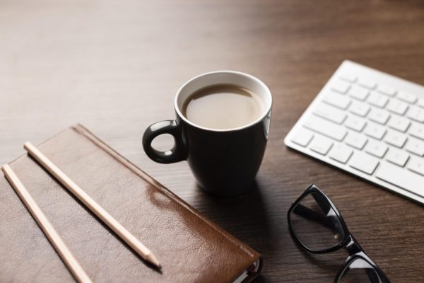 high-angle-desk-arrangement-with-coffee-cup